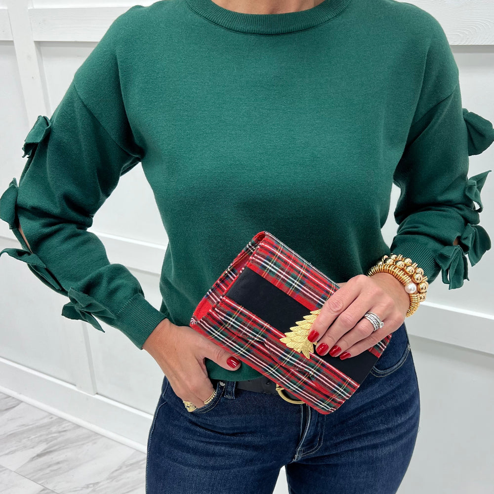 
                  
                    The Bow Edit Sweater
                  
                