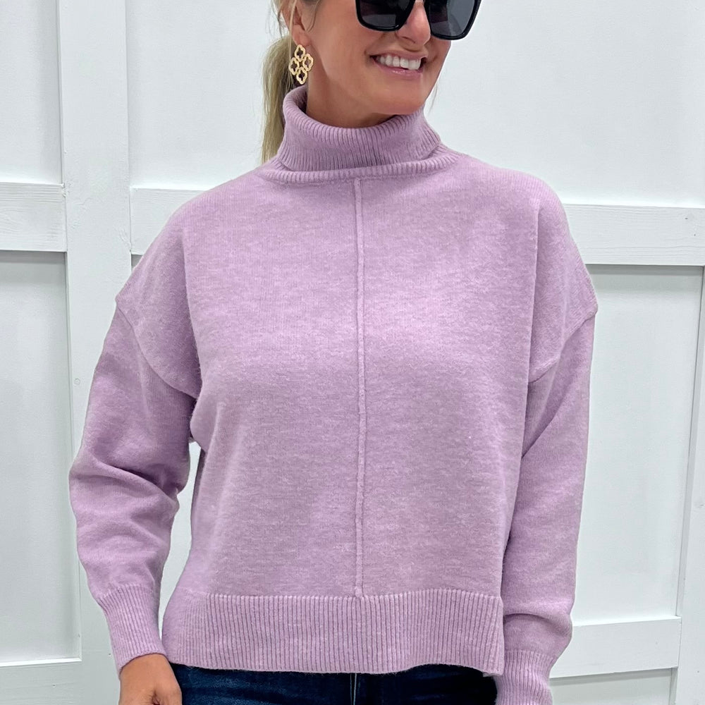 
                  
                    The Adler Turtleneck Sweater (Lavender)
                  
                