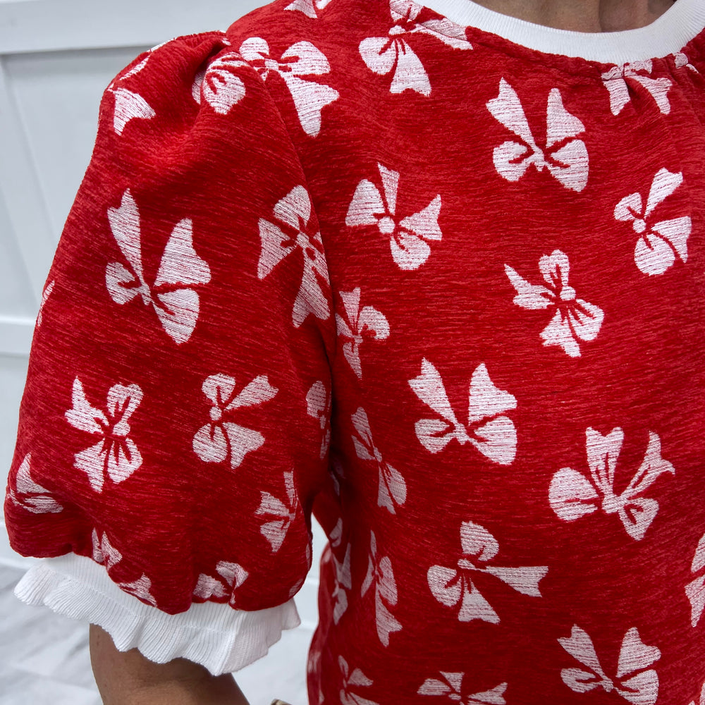 
                  
                    Wrapped In Red Bow Top
                  
                