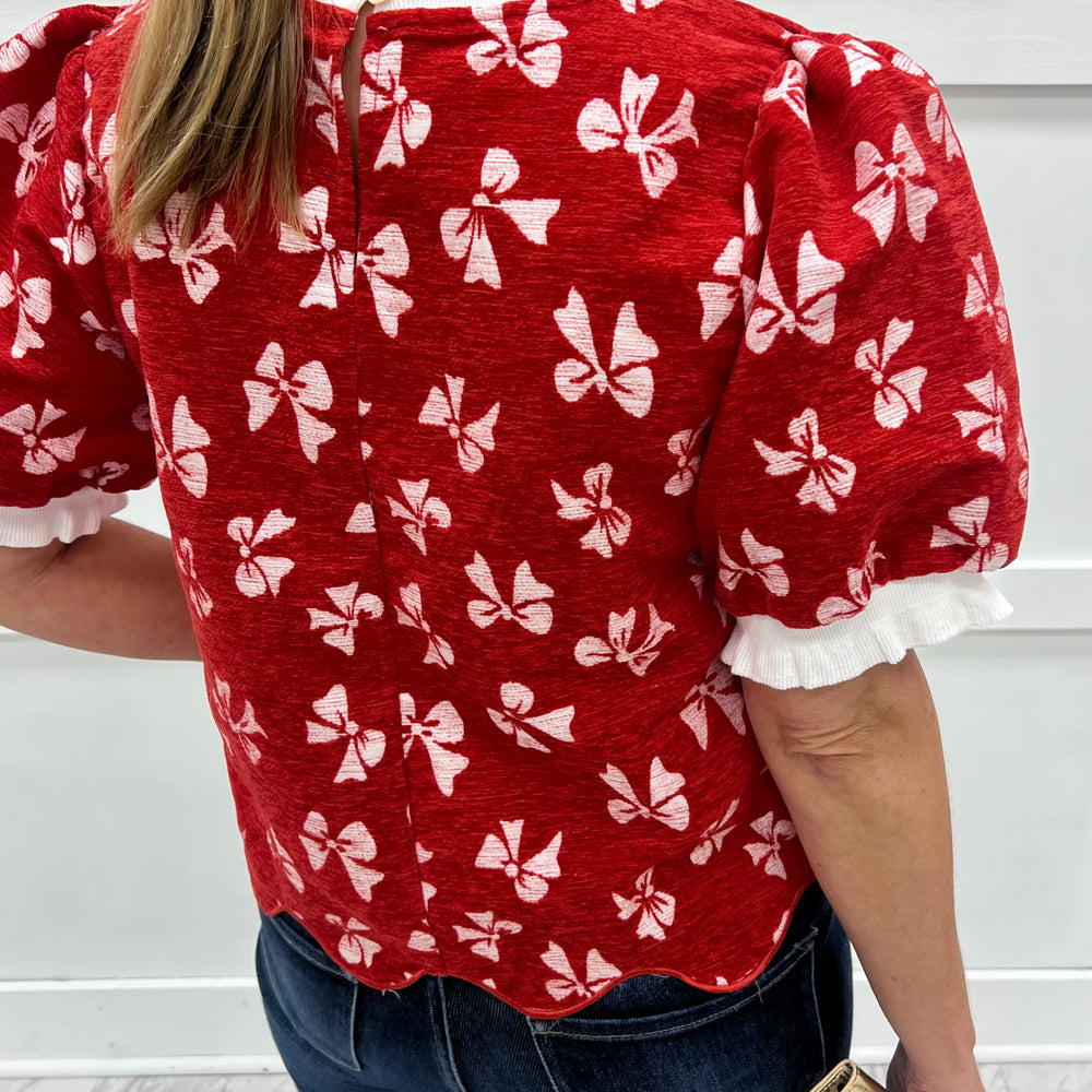 
                  
                    Wrapped In Red Bow Top
                  
                