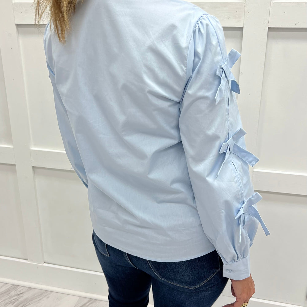 
                  
                    Oxford Bow Button Front Top (Blue)
                  
                